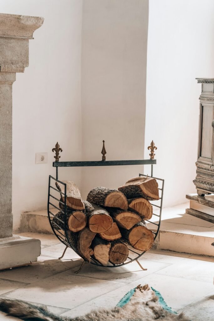 Traditional country hearth with stacked logs and warm natural textures
